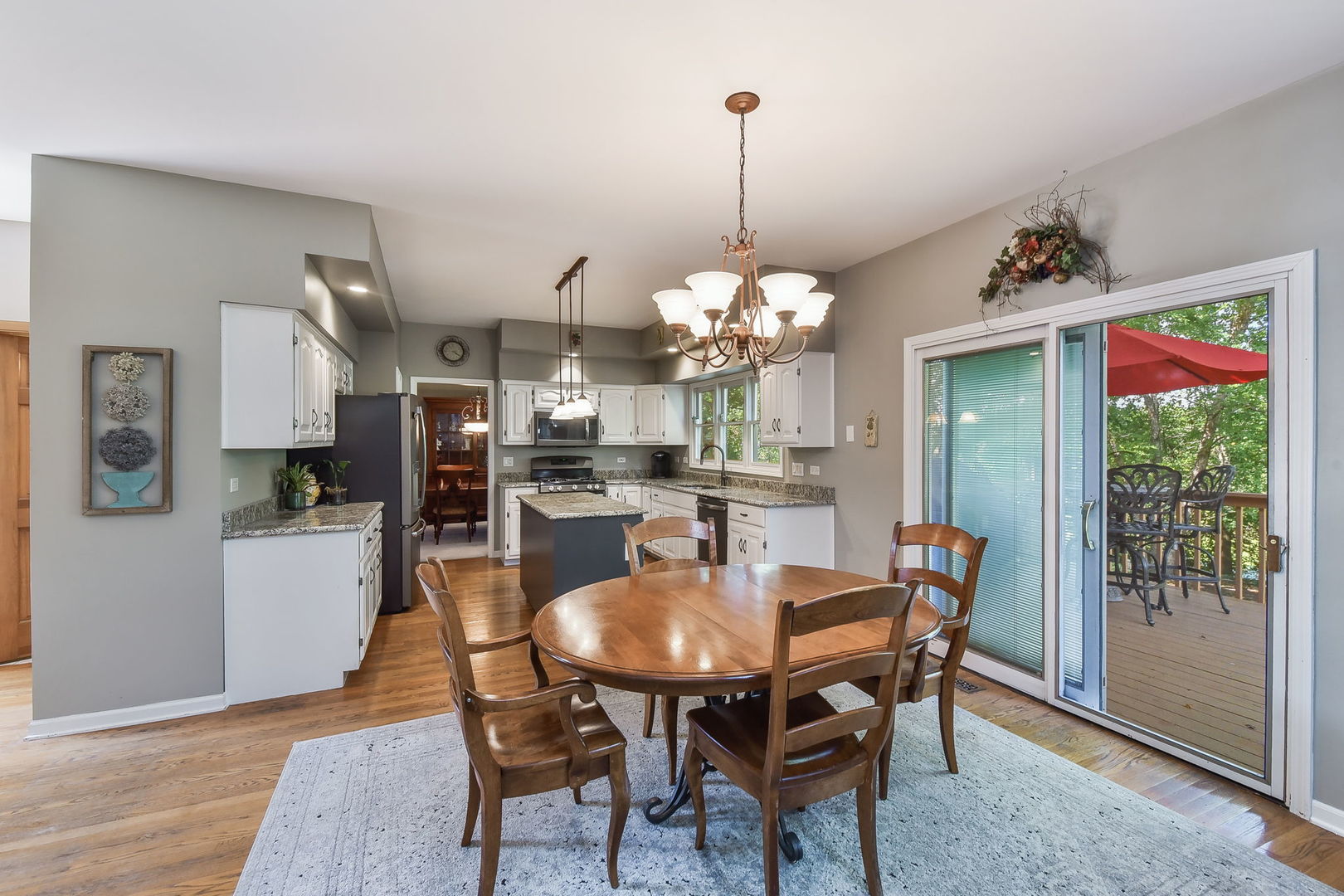 439 Lewis Road Geneva, IL 60134 - Photo 9 of 24 a view of a dining room with furniture window and wooden floor