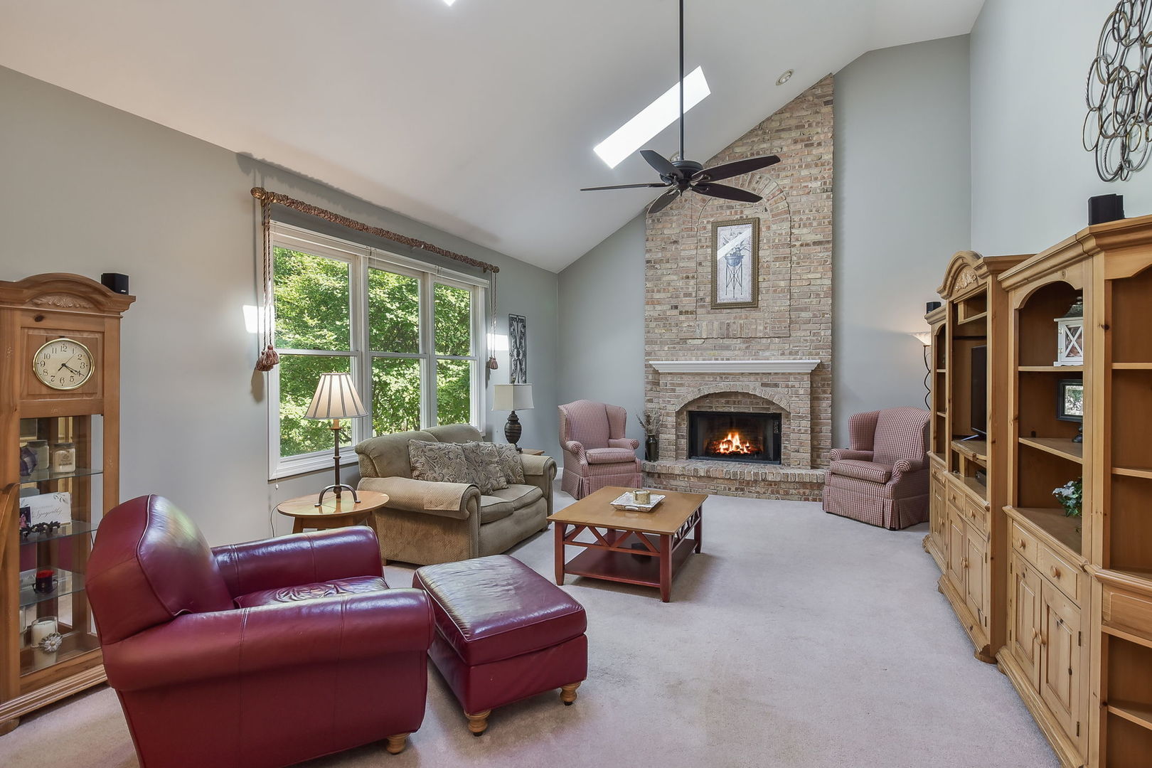 439 Lewis Road Geneva, IL 60134 - Photo 10 of 24 a living room with furniture and a fireplace