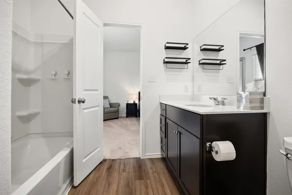 a bedroom with a bed and a television