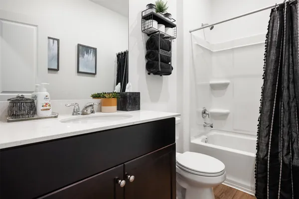 a room that has a bed and a chair in it