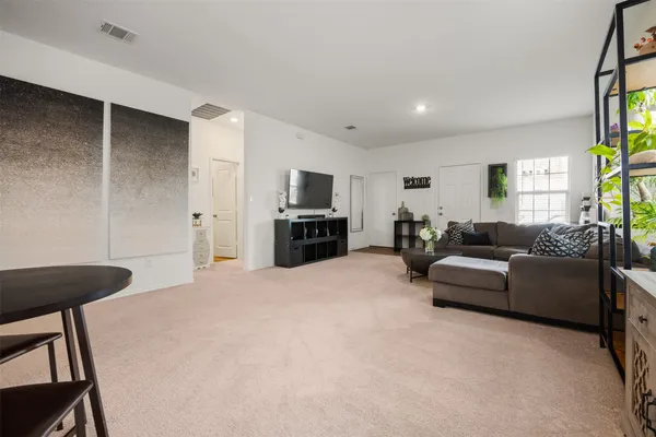 a living room with furniture and a couch