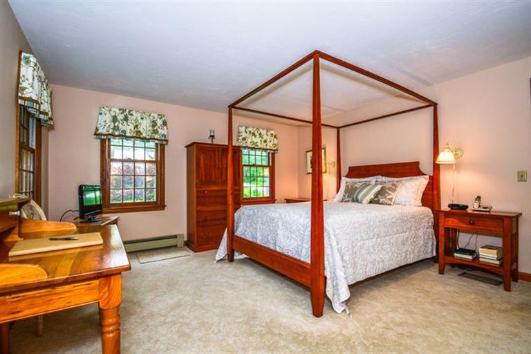 45 Long Hill Road Dennis, MA 02638 - Photo 13 of 26 a bedroom with a bed and a dresser next to a window