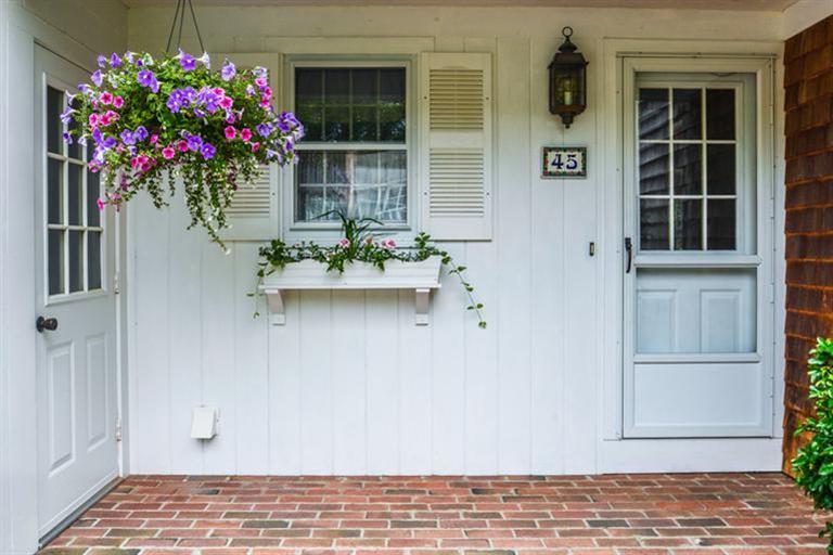 45 Long Hill Road Dennis, MA 02638 - Photo 3 of 26 a front view of a house with a potted plant