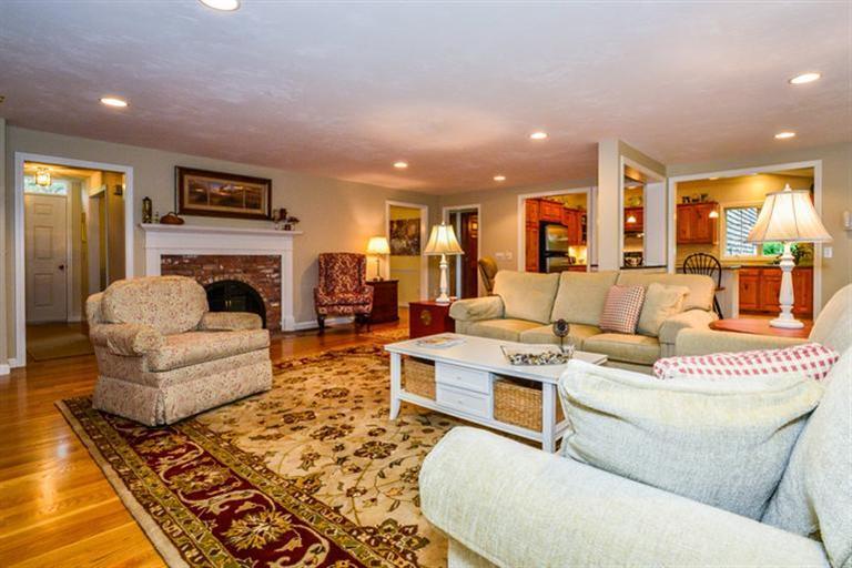45 Long Hill Road Dennis, MA 02638 - Photo 4 of 26 a living room with furniture and a fireplace