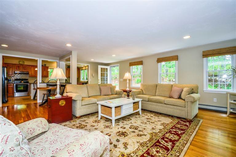 45 Long Hill Road Dennis, MA 02638 - Photo 6 of 26 a living room with furniture and a large window