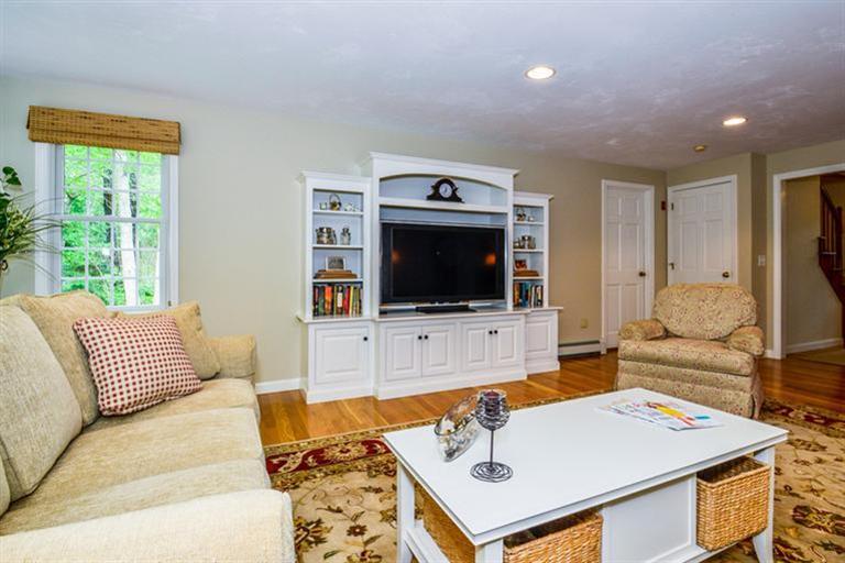 45 Long Hill Road Dennis, MA 02638 - Photo 7 of 26 a living room with furniture and a flat screen tv