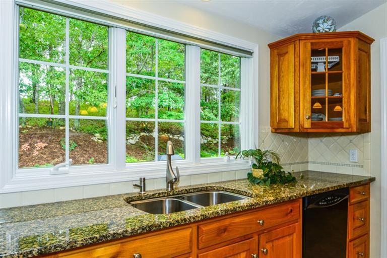 45 Long Hill Road Dennis, MA 02638 - Photo 10 of 26 a kitchen with granite countertop a sink and a window