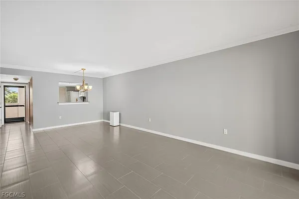 a view of entryway with kitchen