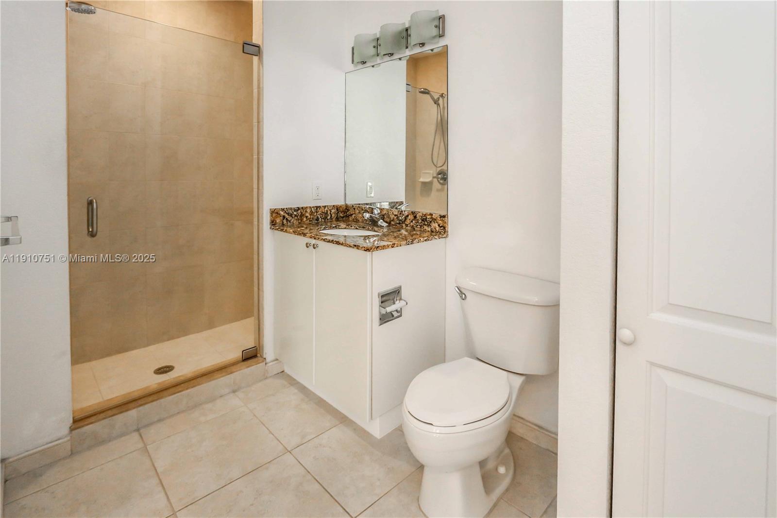 1830 Radius Drive, Unit 1119 Hollywood, FL 33020 - Photo 16 of 53 a bathroom with a toilet a sink and shower