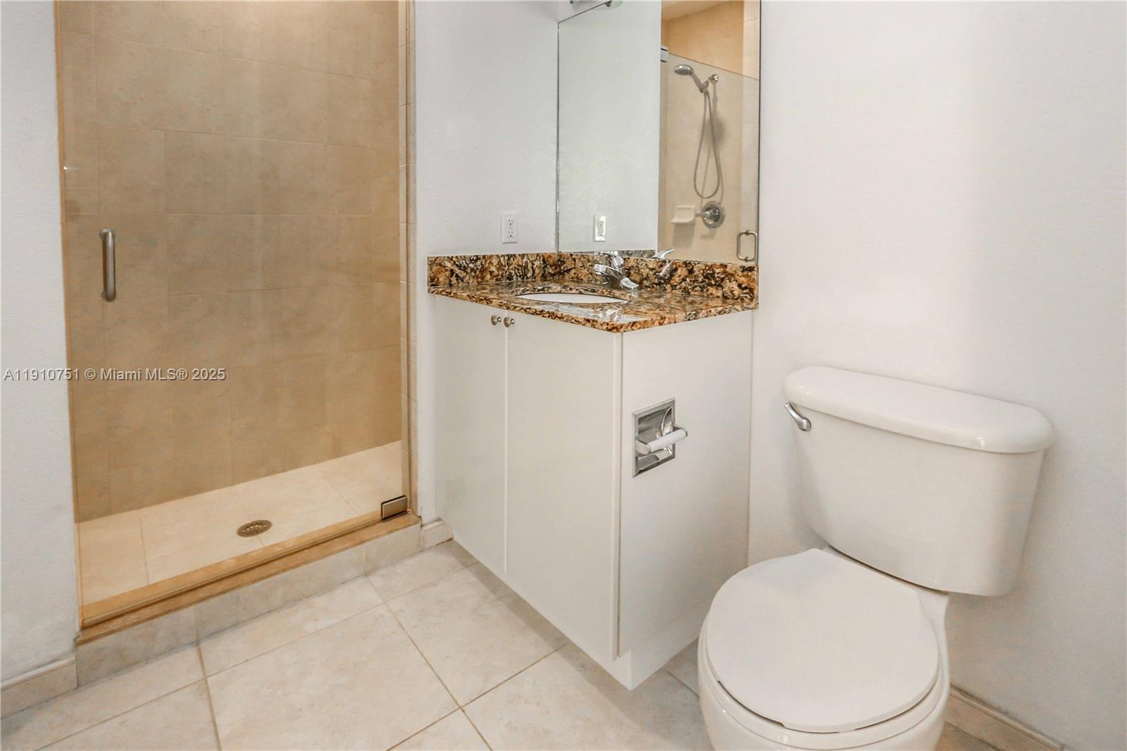 1830 Radius Drive, Unit 1119 Hollywood, FL 33020 - Photo 17 of 53 a white toilet sitting next to a bathroom sink