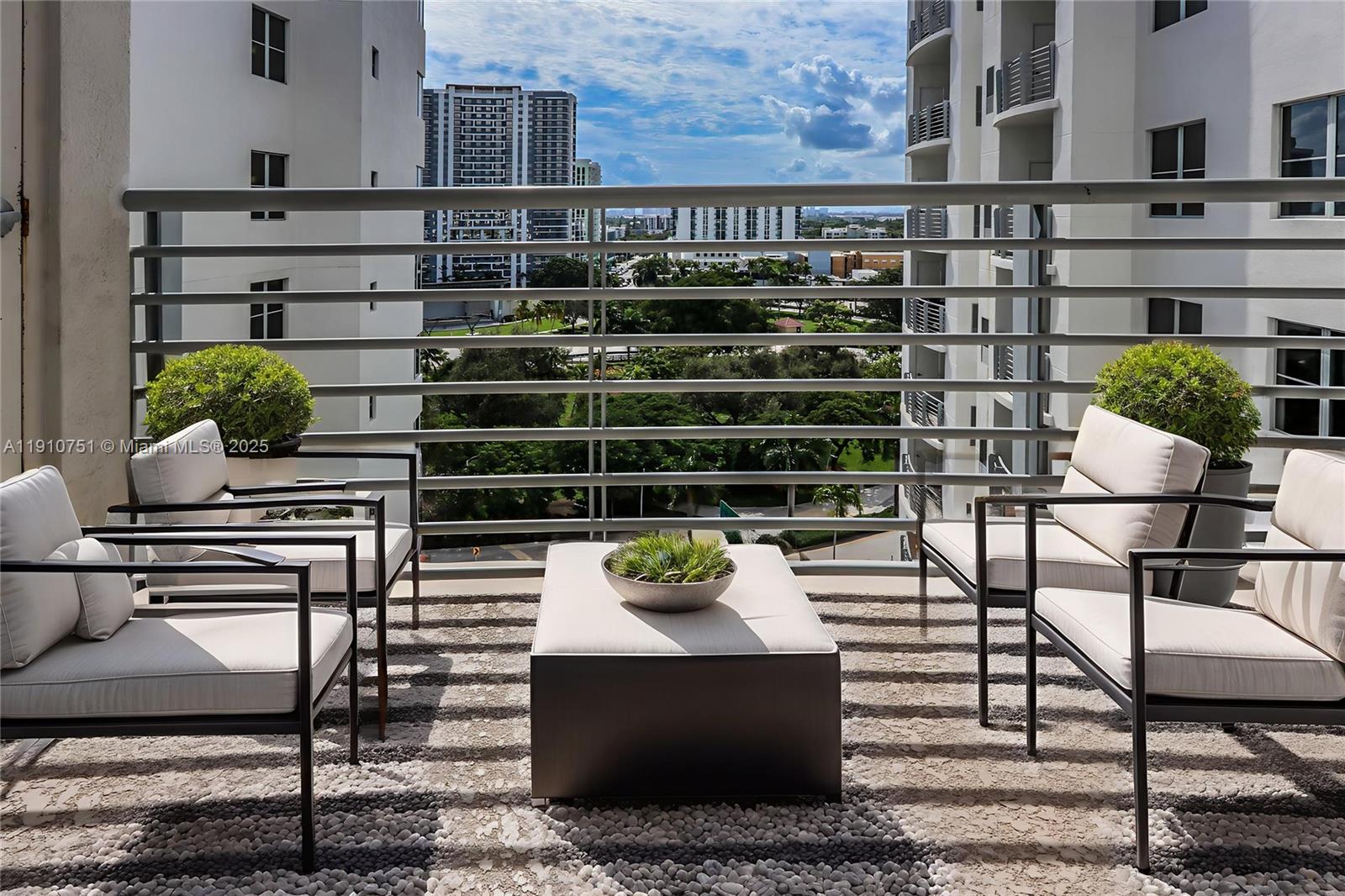 1830 Radius Drive, Unit 1119 Hollywood, FL 33020 - Photo 3 of 53 a view of a chairs and table in the back yard
