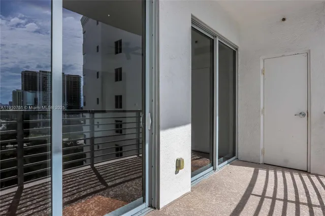 a view of an ocean with building in the background