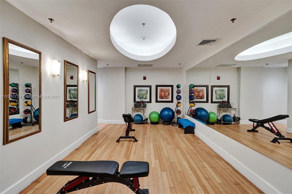 1830 Radius Drive, Unit 1119 Hollywood, FL 33020 - Photo 37 of 53 a living room with furniture and wooden floor