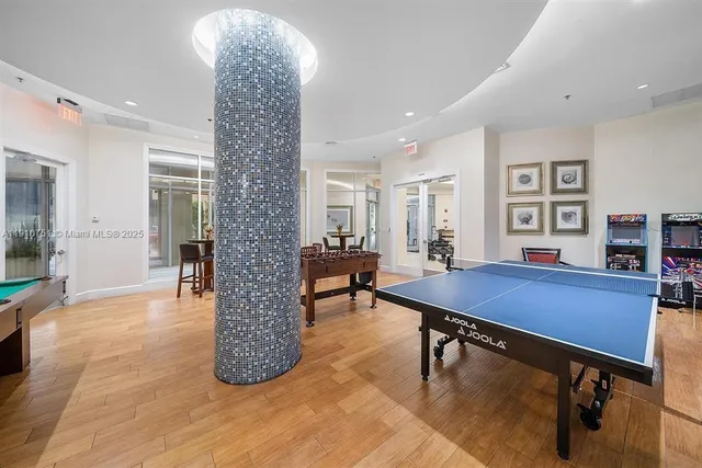 a view of a livingroom with furniture and a window