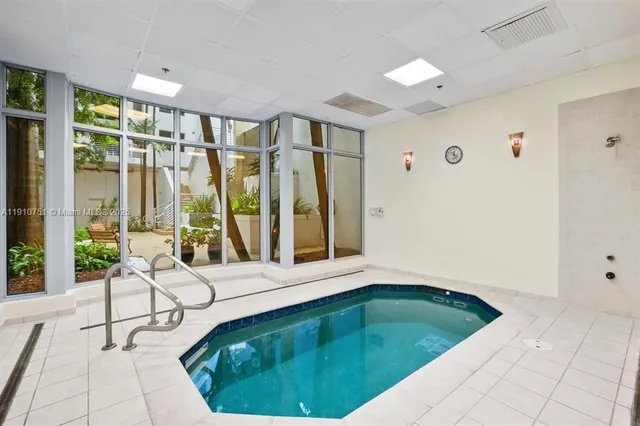 a view of an house with backyard and sitting area