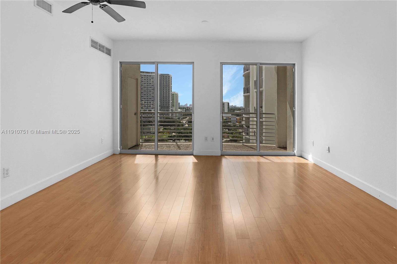 1830 Radius Drive, Unit 1119 Hollywood, FL 33020 - Photo 8 of 53 wooden floor in an empty room with a window