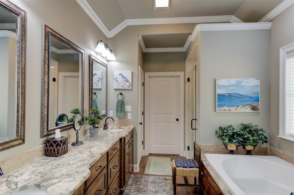 151 Pepperridge Circle Minden, LA 71055 - Photo 17 of 32 a spacious bathroom with a granite countertop tub a mirror and shower