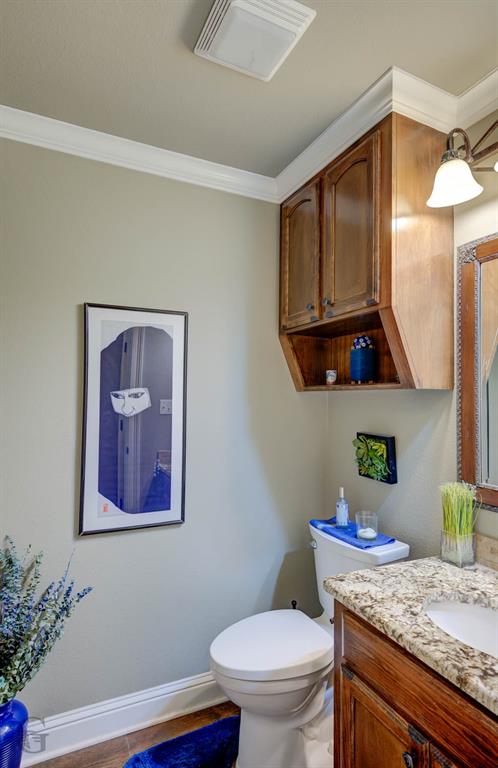 151 Pepperridge Circle Minden, LA 71055 - Photo 24 of 32 a bathroom with a granite countertop toilet sink and mirror