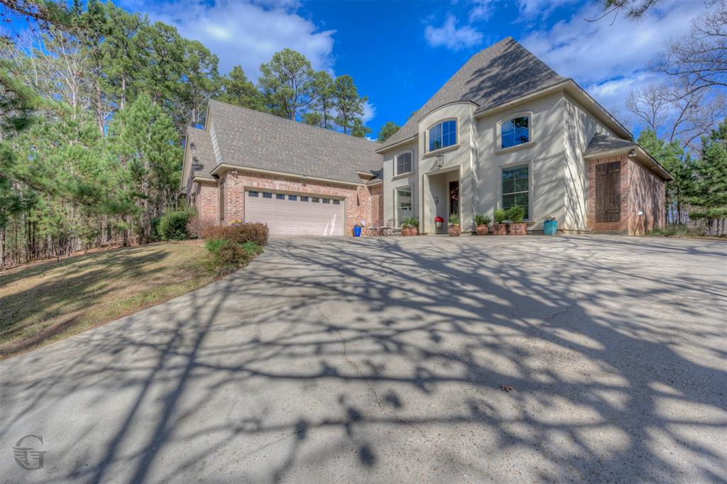 151 Pepperridge Circle Minden, LA 71055 - Photo 30 of 32 a front view of a house with a yard