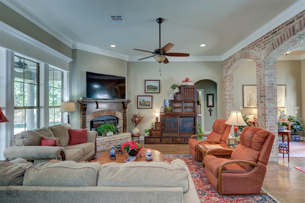 151 Pepperridge Circle Minden, LA 71055 - Photo 10 of 32 a living room with fireplace furniture and a flat screen tv