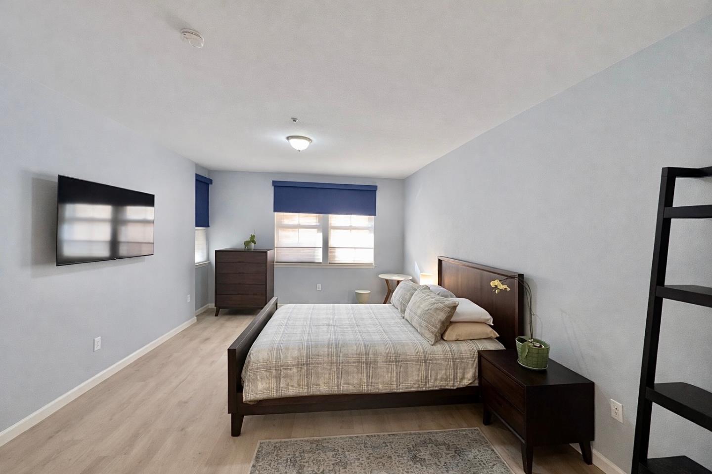 1310 Saddle Rack Street, Unit 347 San Jose, CA 95126 - Photo 15 of 42 a bedroom with a bed and wooden floor