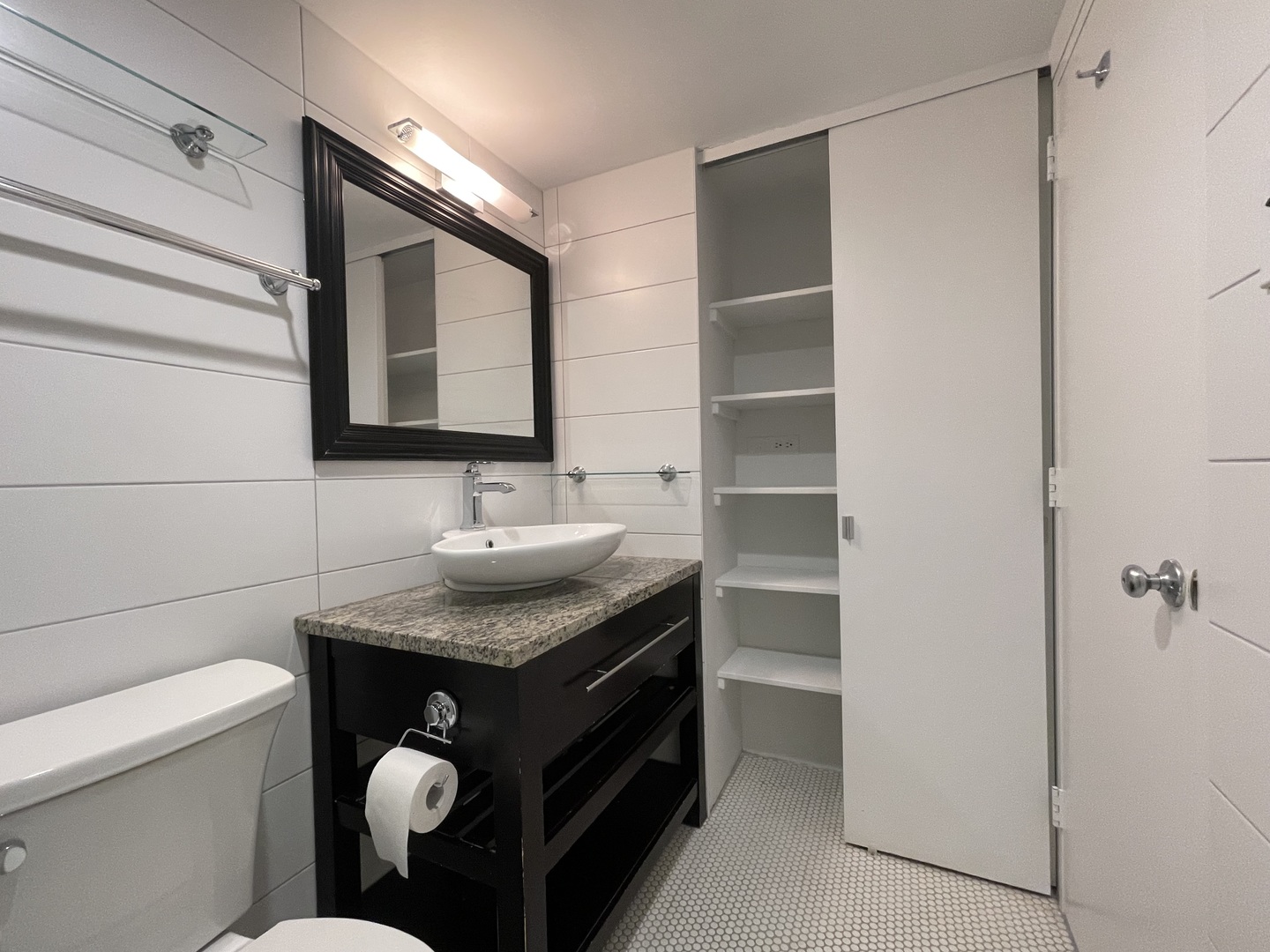 175 East Delaware Place, Unit 5004 Chicago, IL 60611 - Photo 14 of 17 a bathroom with a granite countertop sink toilet and mirror