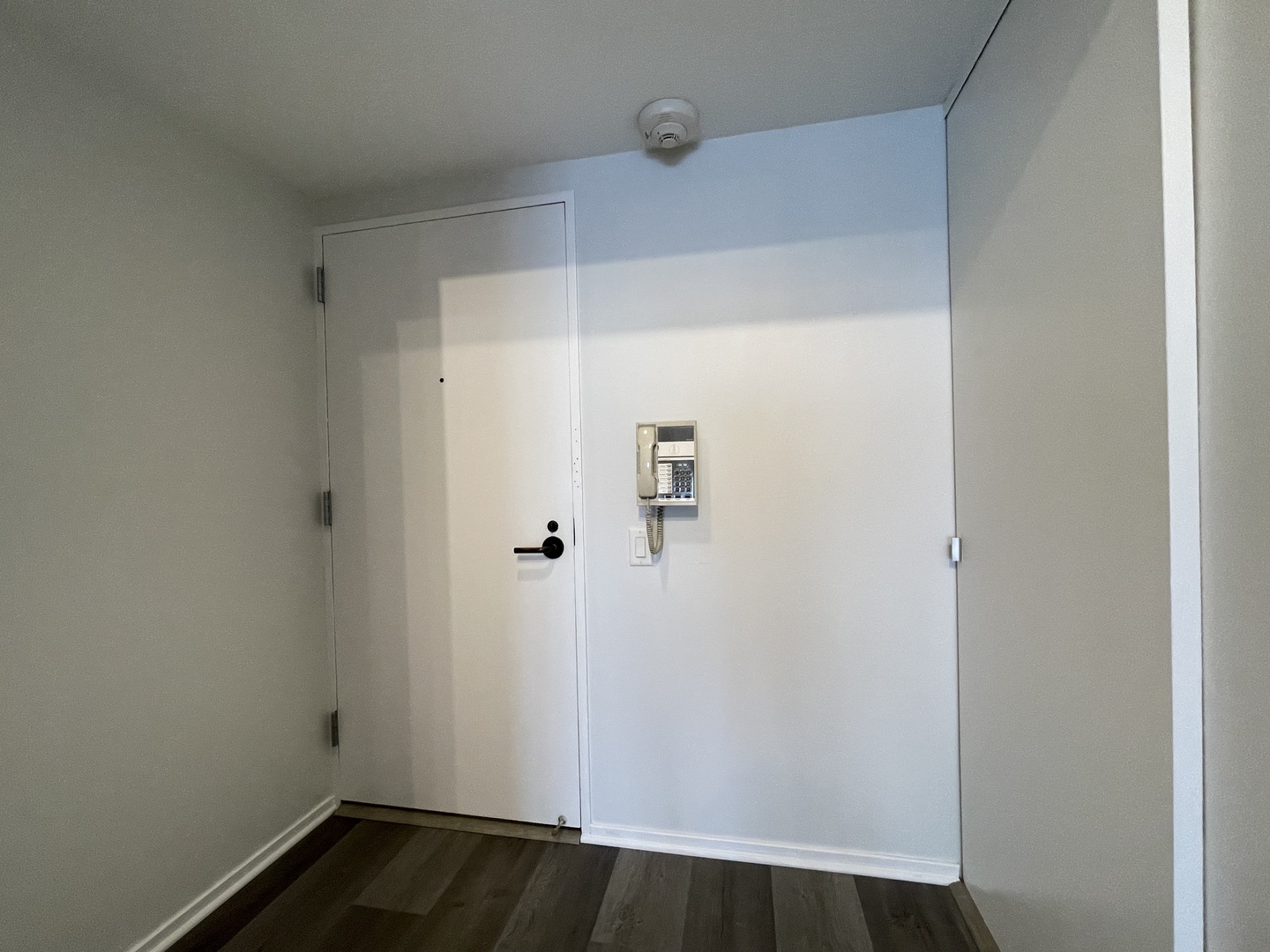 175 East Delaware Place, Unit 5004 Chicago, IL 60611 - Photo 2 of 17 a view of small space with wooden floor