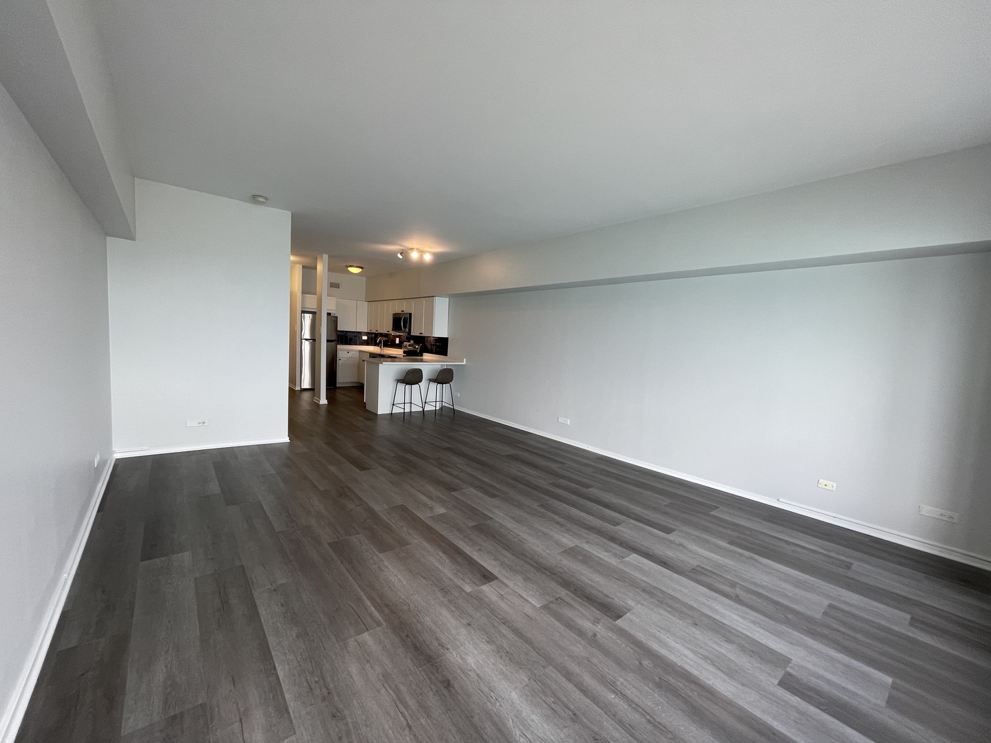 175 East Delaware Place, Unit 5004 Chicago, IL 60611 - Photo 10 of 17 a view of a room with wooden floor