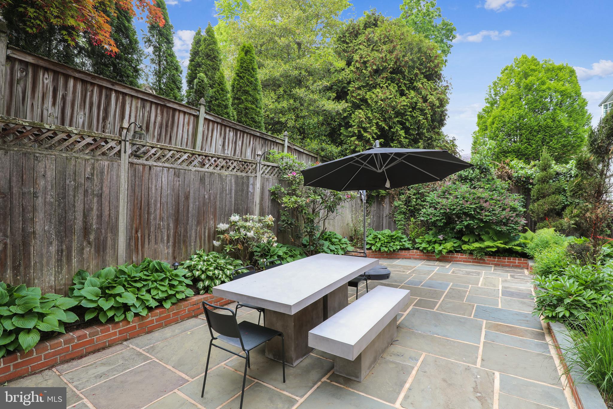 7704 Chatham Road Chevy Chase, MD 20815 - Photo 38 of 43 Flagstone patio surrounded by lovely gardens