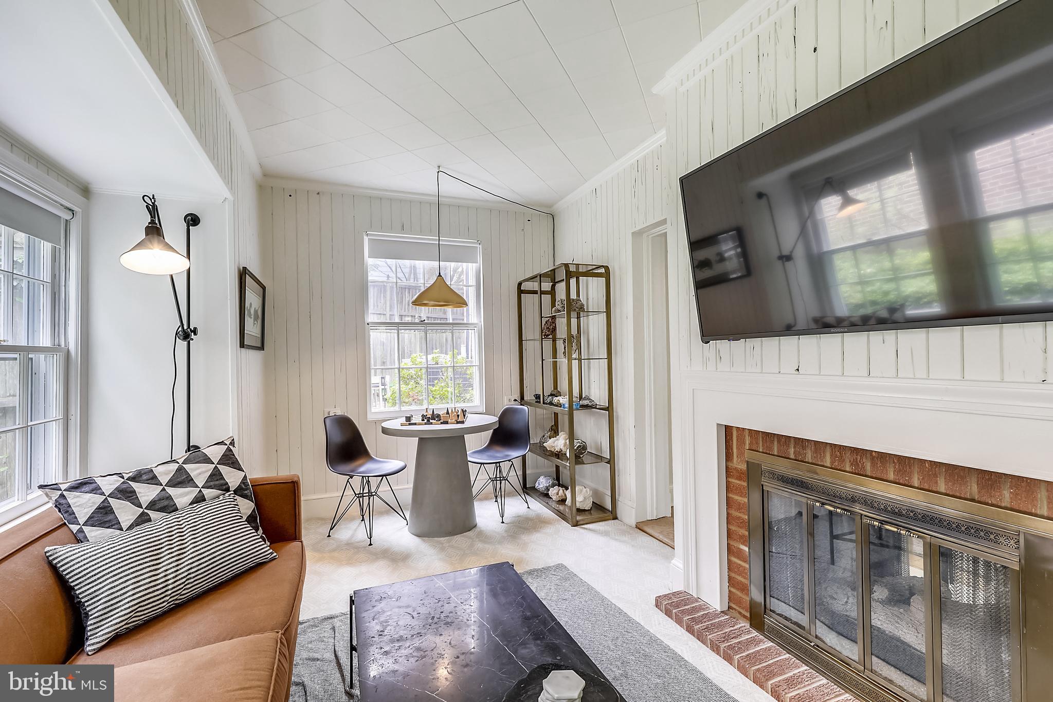 7704 Chatham Road Chevy Chase, MD 20815 - Photo 9 of 43 The dual-sided fireplace keeps this room so warm!