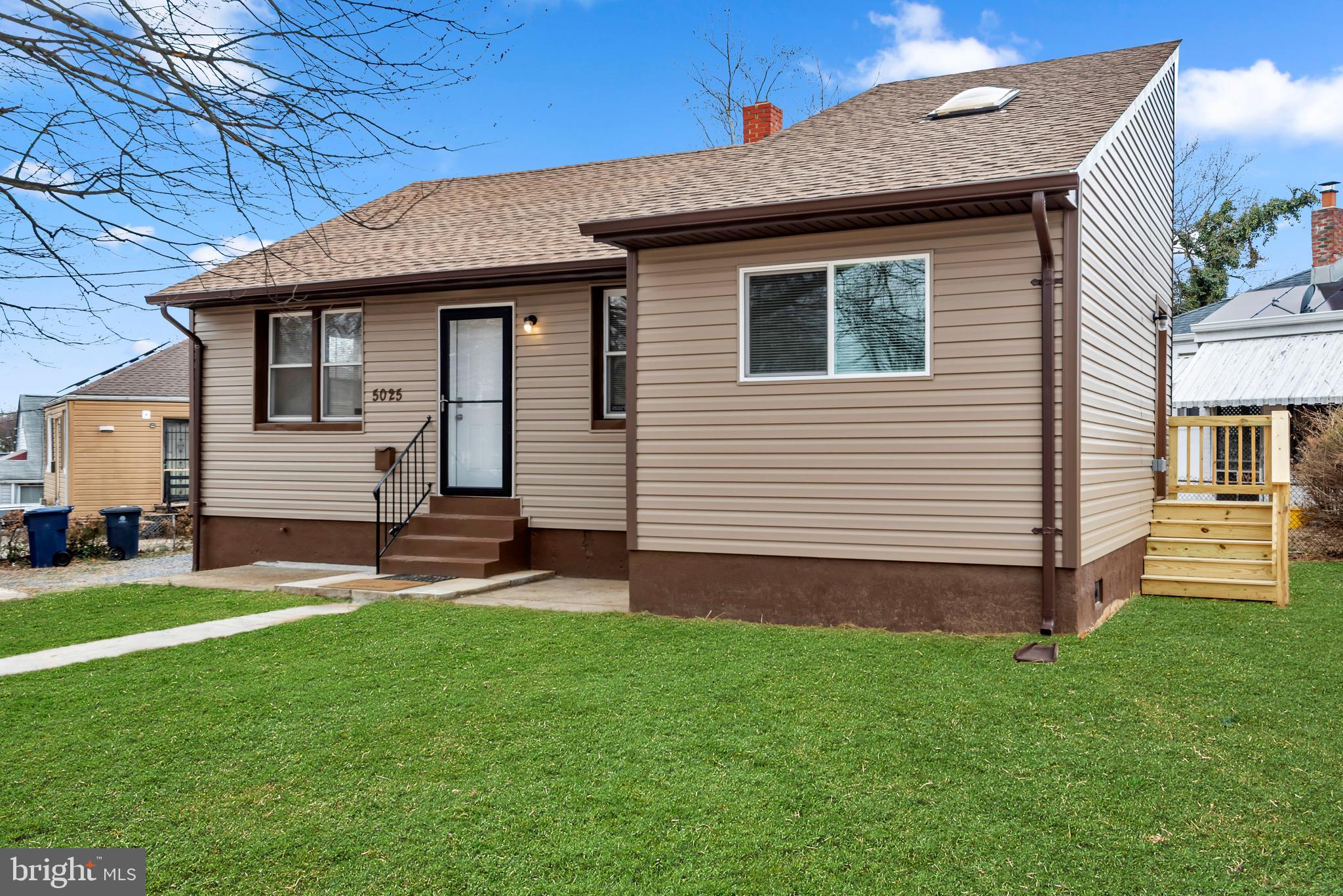 5025 Addison Road Capitol Heights, MD 20743 - Photo 1 of 37 a front view of a house with a yard and table