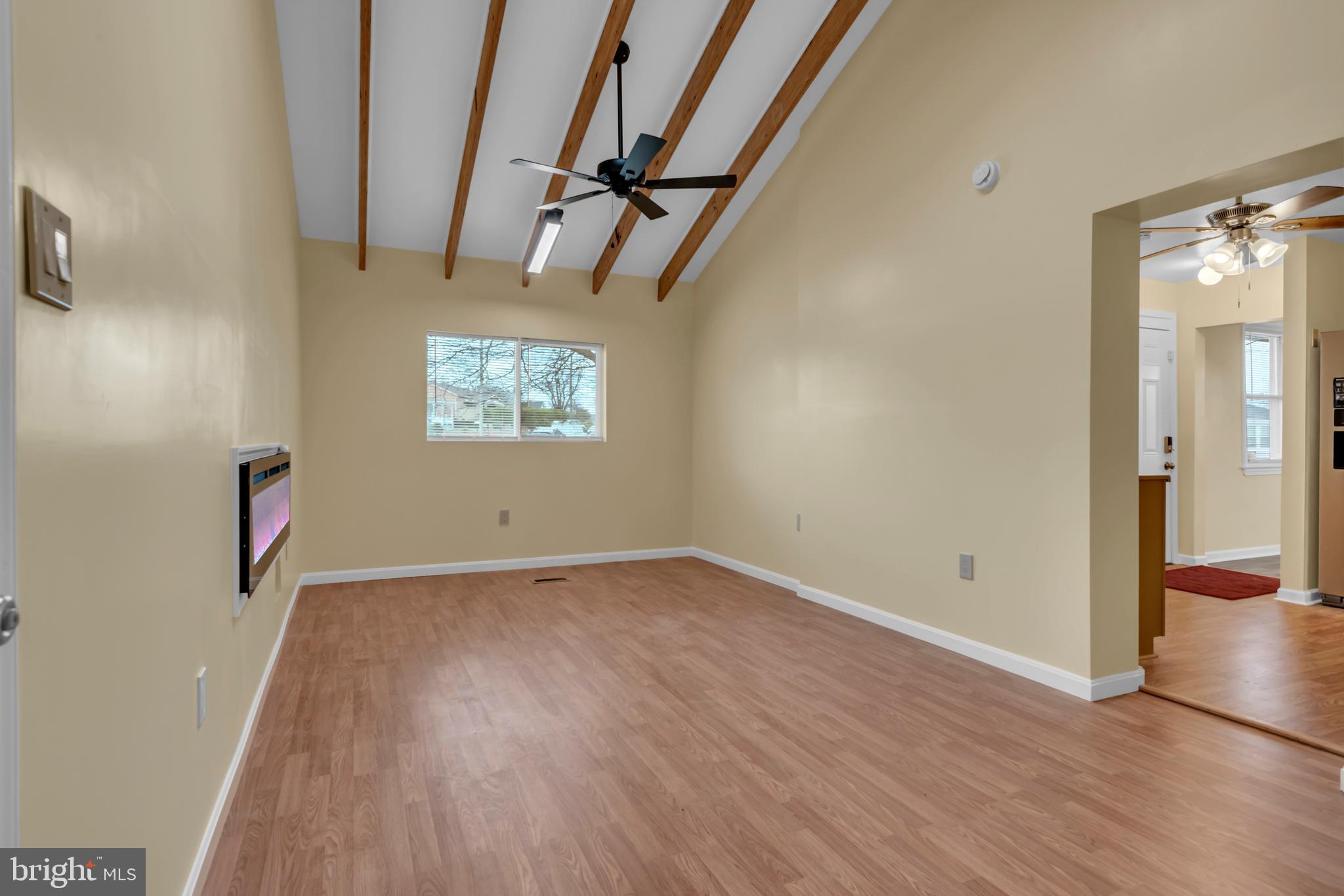 5025 Addison Road Capitol Heights, MD 20743 - Photo 14 of 37 an empty room with wooden floor and windows