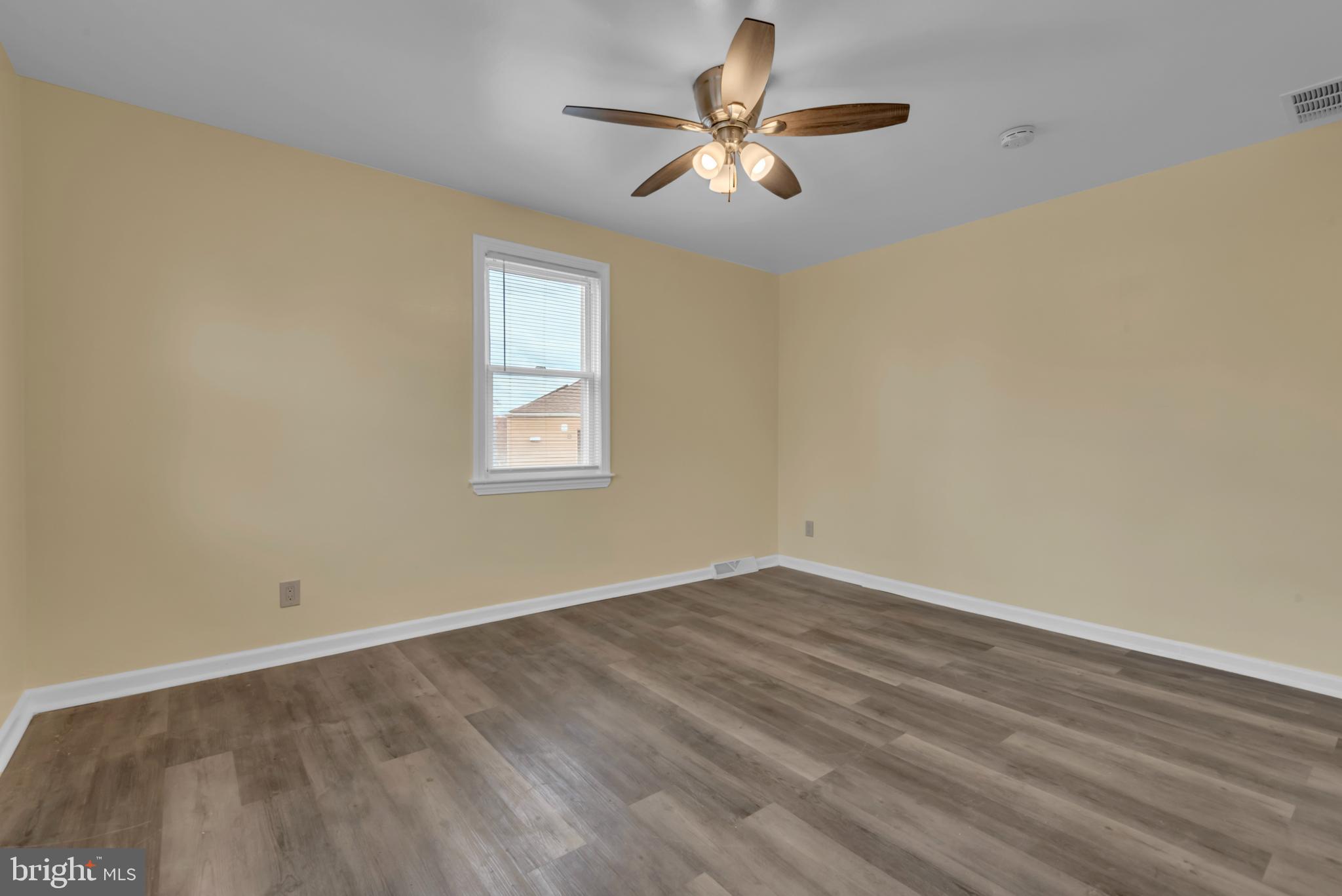 5025 Addison Road Capitol Heights, MD 20743 - Photo 18 of 37 an empty room with a window and a fan
