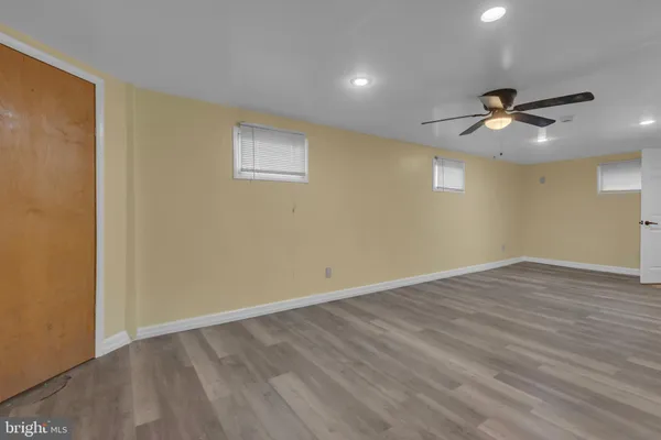 a kitchen with a refrigerator and cabinets