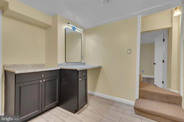 a bathroom with a toilet a sink and shower