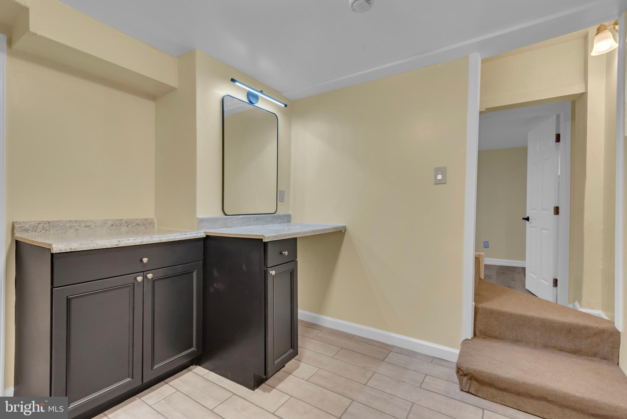 5025 Addison Road Capitol Heights, MD 20743 - Photo 29 of 37 a bathroom with a sink and a mirror