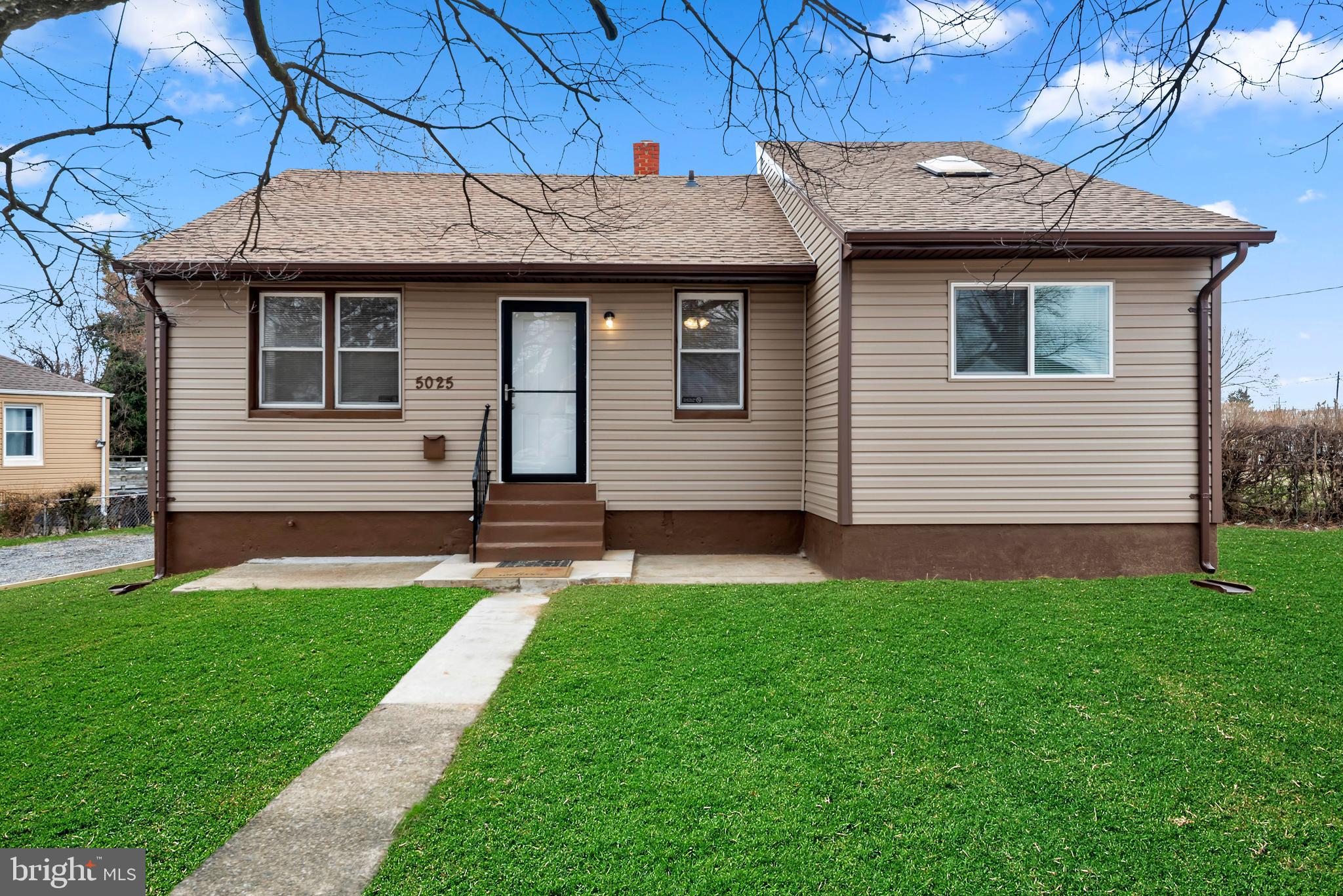5025 Addison Road Capitol Heights, MD 20743 - Photo 3 of 37 a front view of a house with a yard