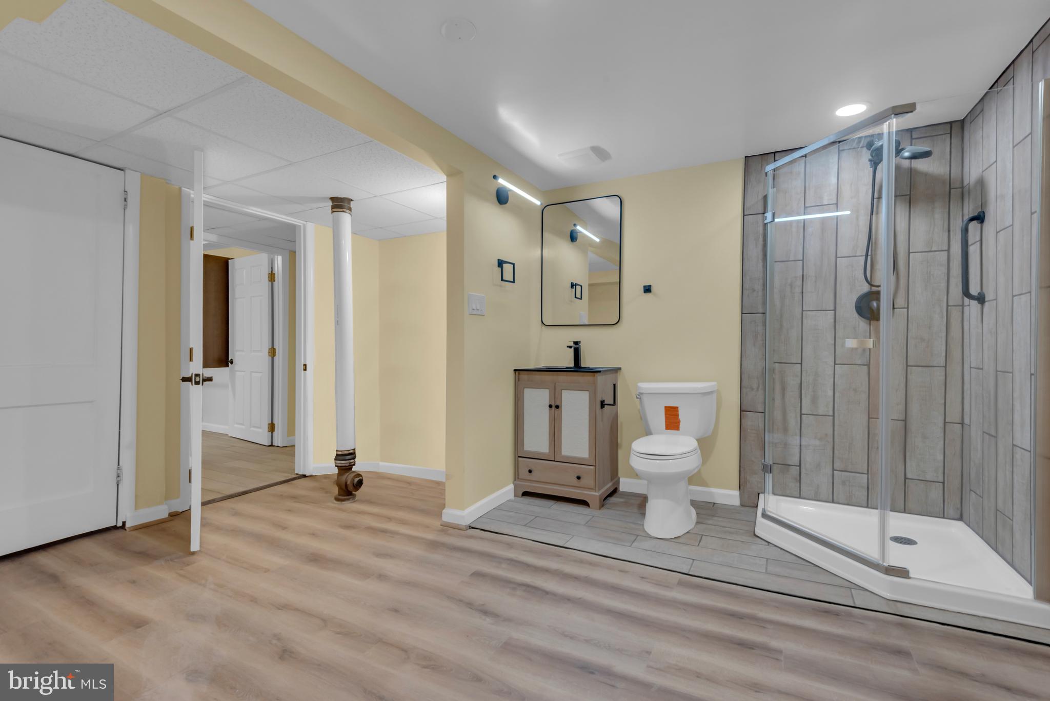 5025 Addison Road Capitol Heights, MD 20743 - Photo 31 of 37 a bathroom with a shower a toilet and a sink