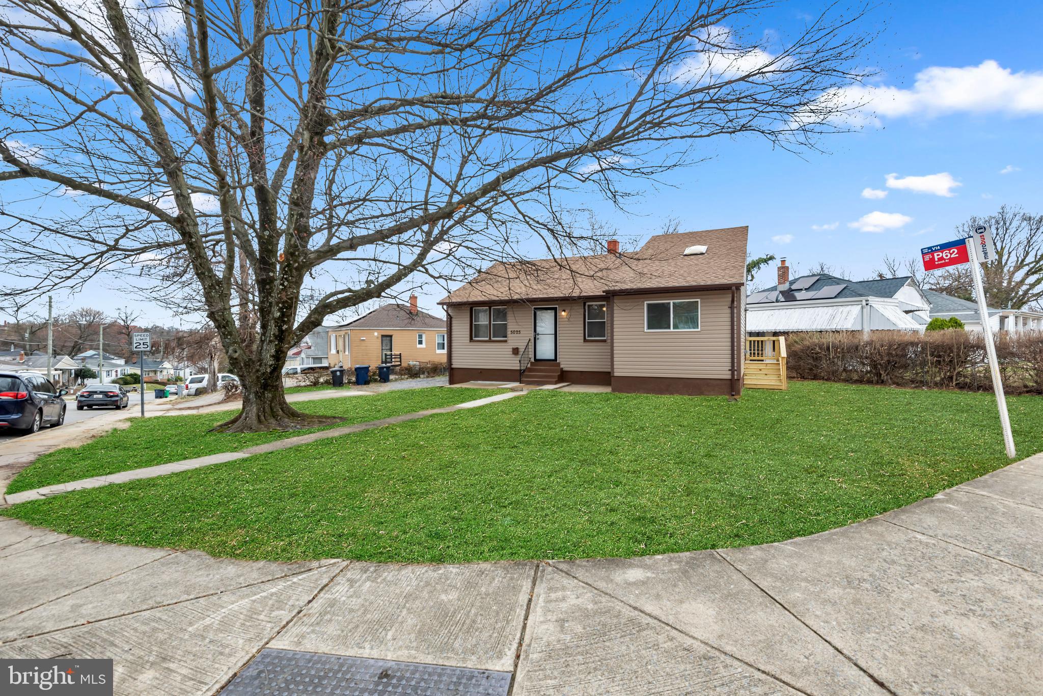 5025 Addison Road Capitol Heights, MD 20743 - Photo 4 of 37 a front view of a house with a yard