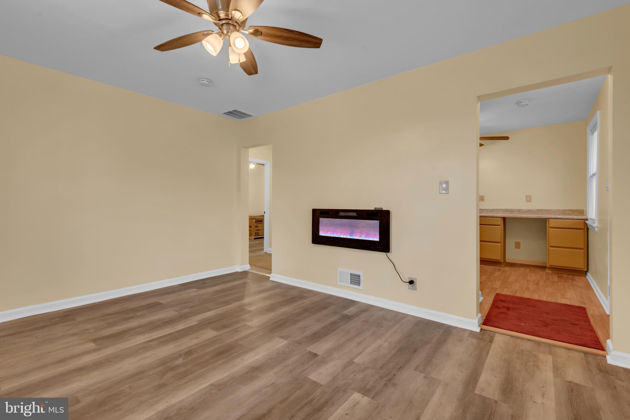 5025 Addison Road Capitol Heights, MD 20743 - Photo 6 of 37 a view of empty room with wooden floor and fan