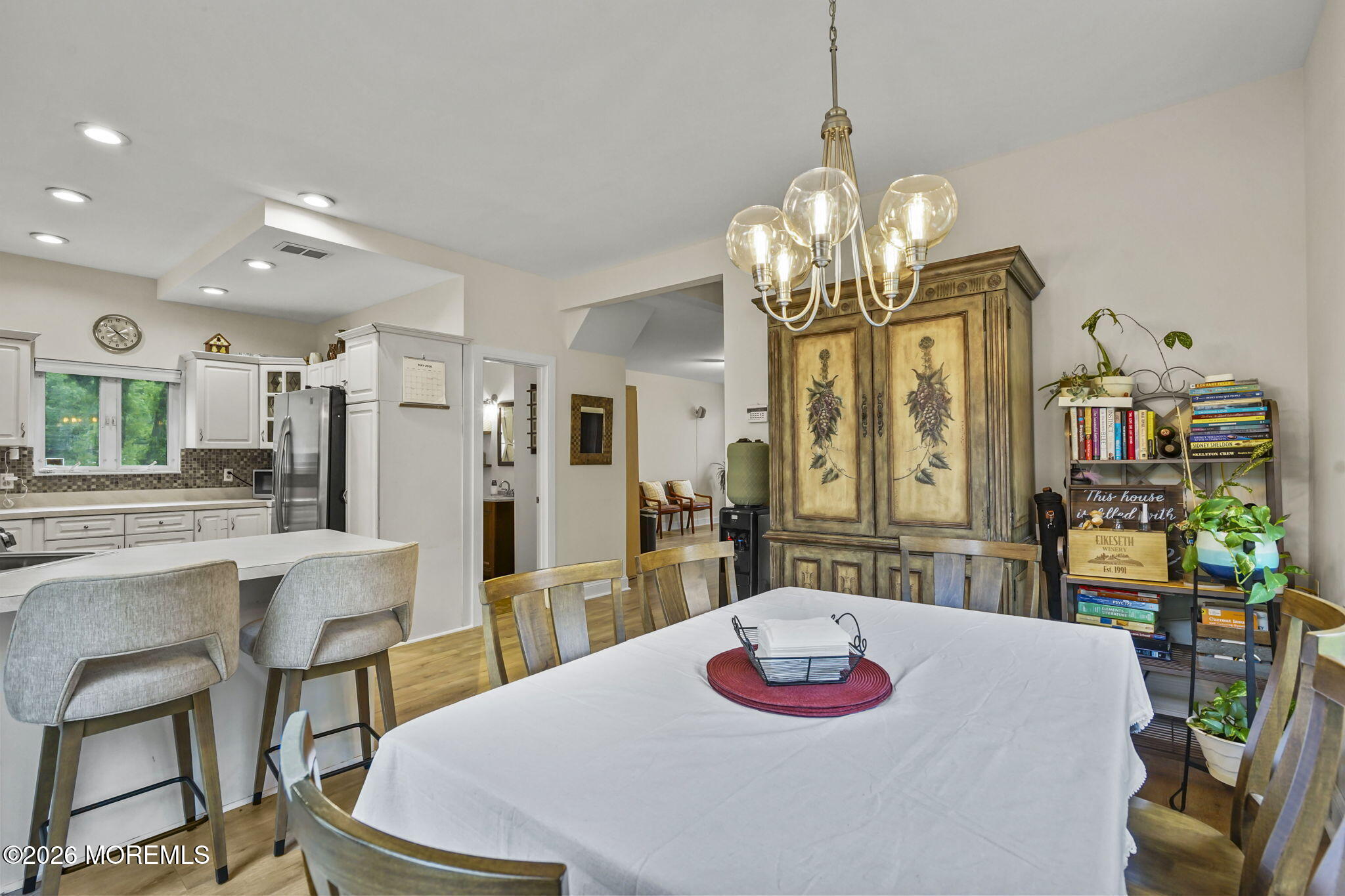438 Bennetts Mills Road Jackson, NJ 08527 - Photo 9 of 42 a dining room with furniture and a chandelier