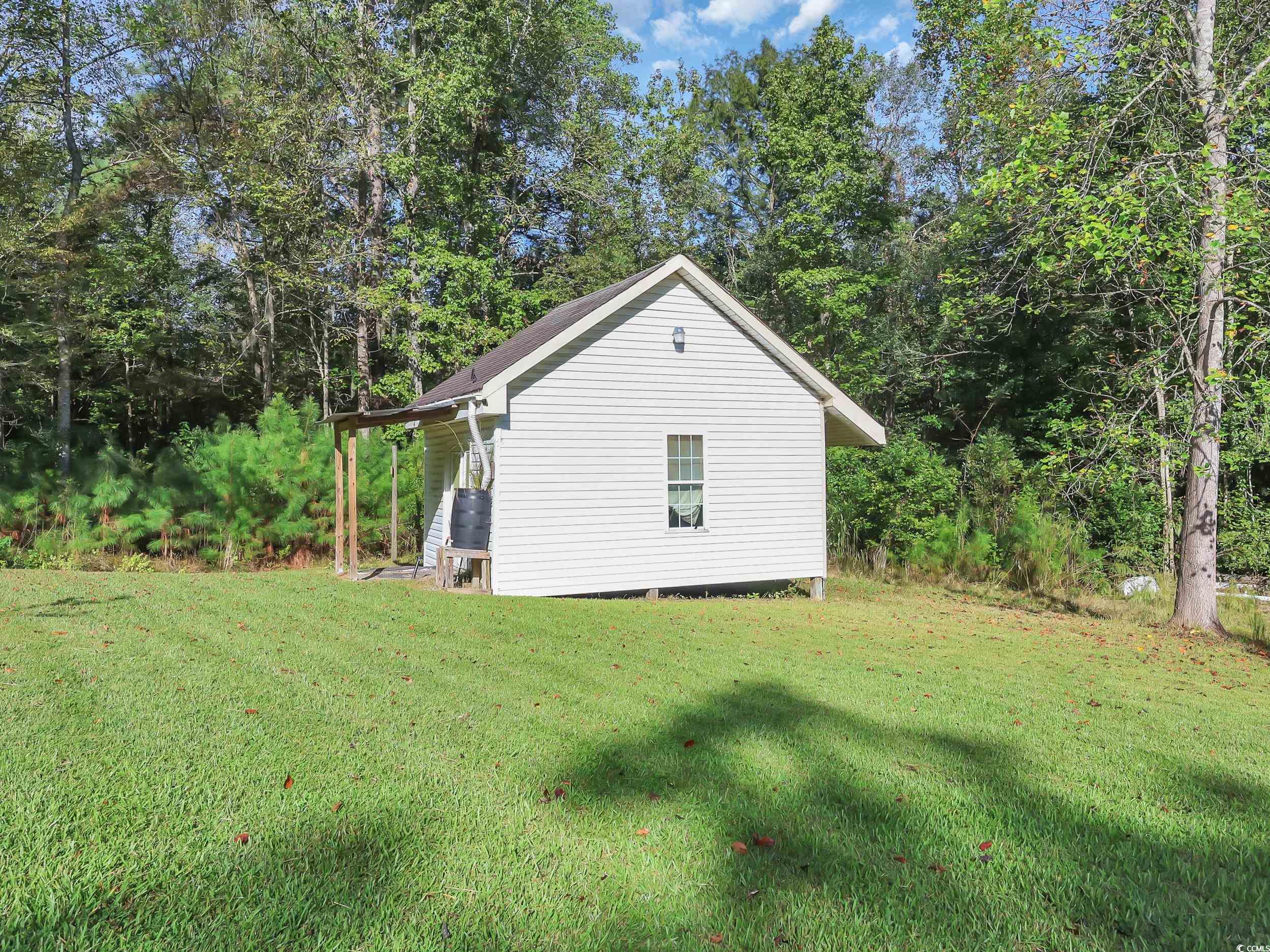 3731 Love Lane Conway, SC 29527 - Photo 26 of 32 View of side of home featuring a yard
