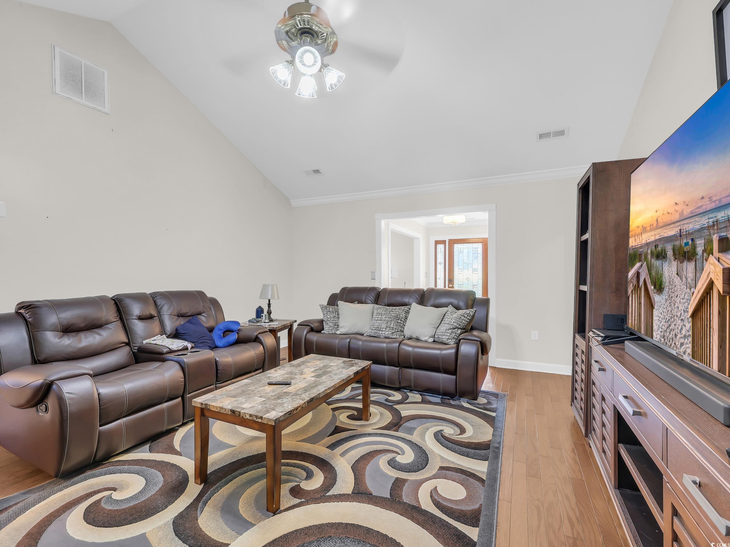 3731 Love Lane Conway, SC 29527 - Photo 9 of 32 Living area with light wood-style flooring, lofted ceiling, and a ceiling fan