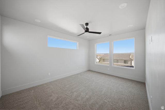 3011 East Rimrunner Drive, Unit 302 St. George, UT 84790 - Photo 35 of 45 Unfurnished room featuring light colored carpet, plenty of natural light, and a ceiling fan