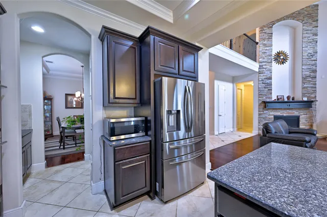 a bathroom with a granite countertop sink a mirror and vanity