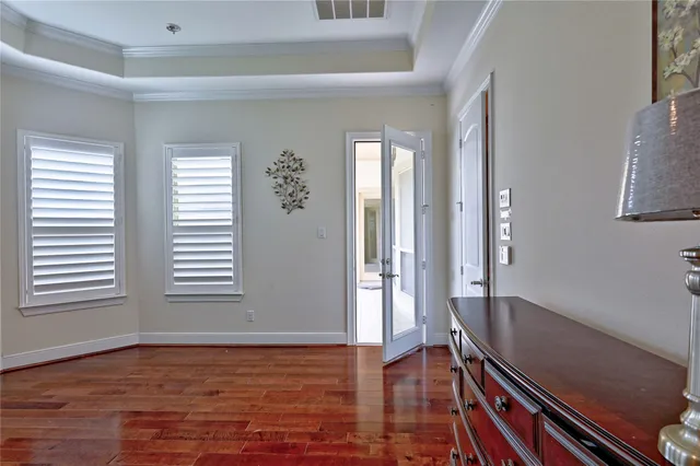a spacious bathroom with a tub sink and mirror