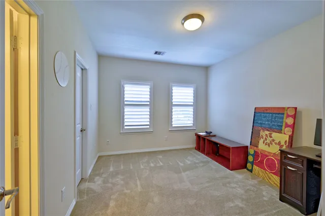 a bathroom with a granite countertop sink a mirror and a shower