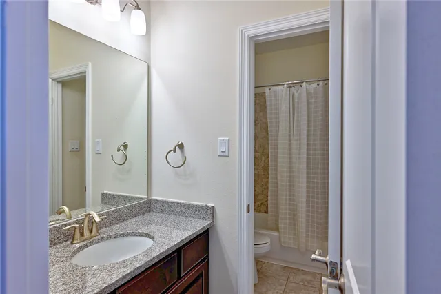 a bathroom with a sink and mirror