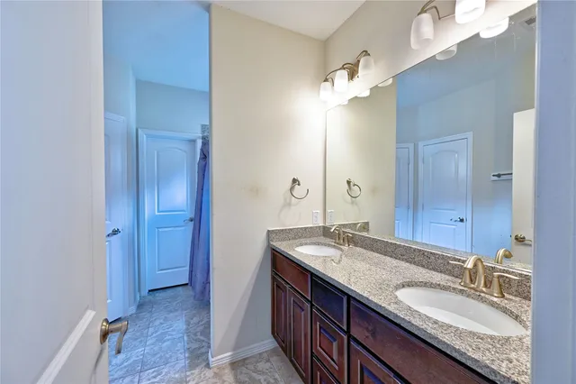a bathroom with a bathtub and shower