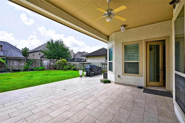 a front view of a house with yard and green space